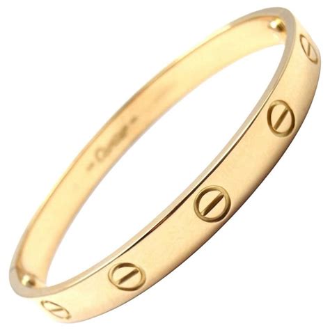 gold bracelet with circle and line through it|spiral sigil.